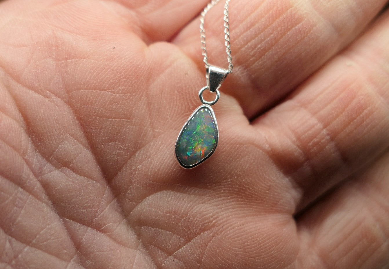 Opalised shell pendant
