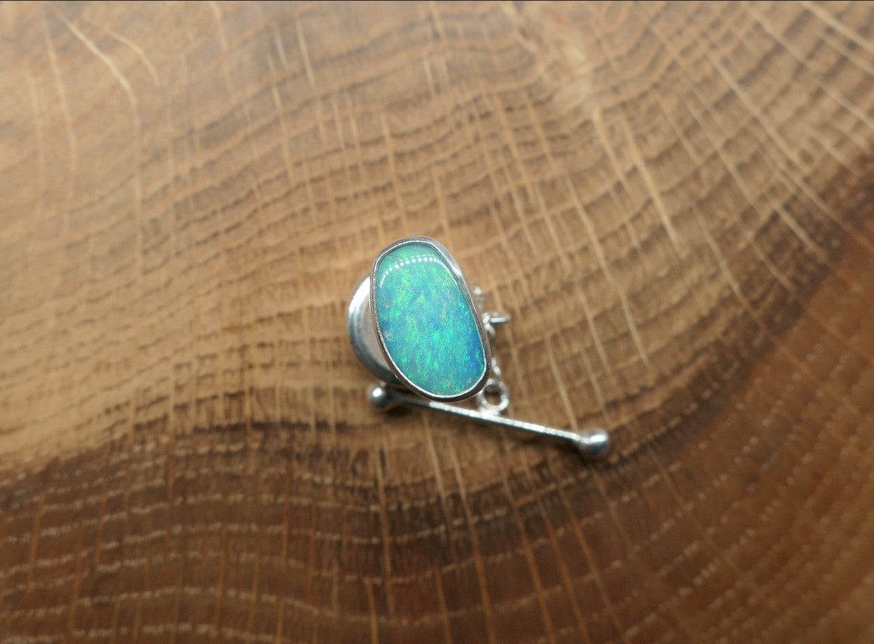 Silver tie tack with a Coober Pedy opal