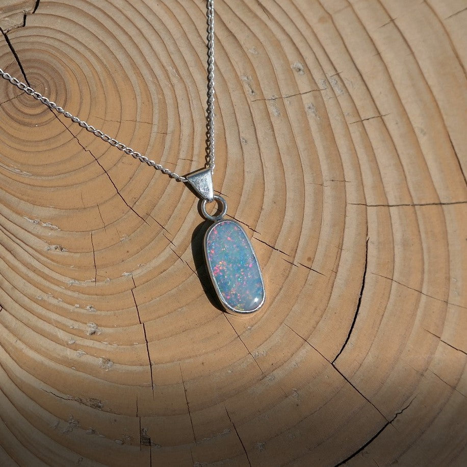 Silver opal pendant with a Coober Pedy doublet.