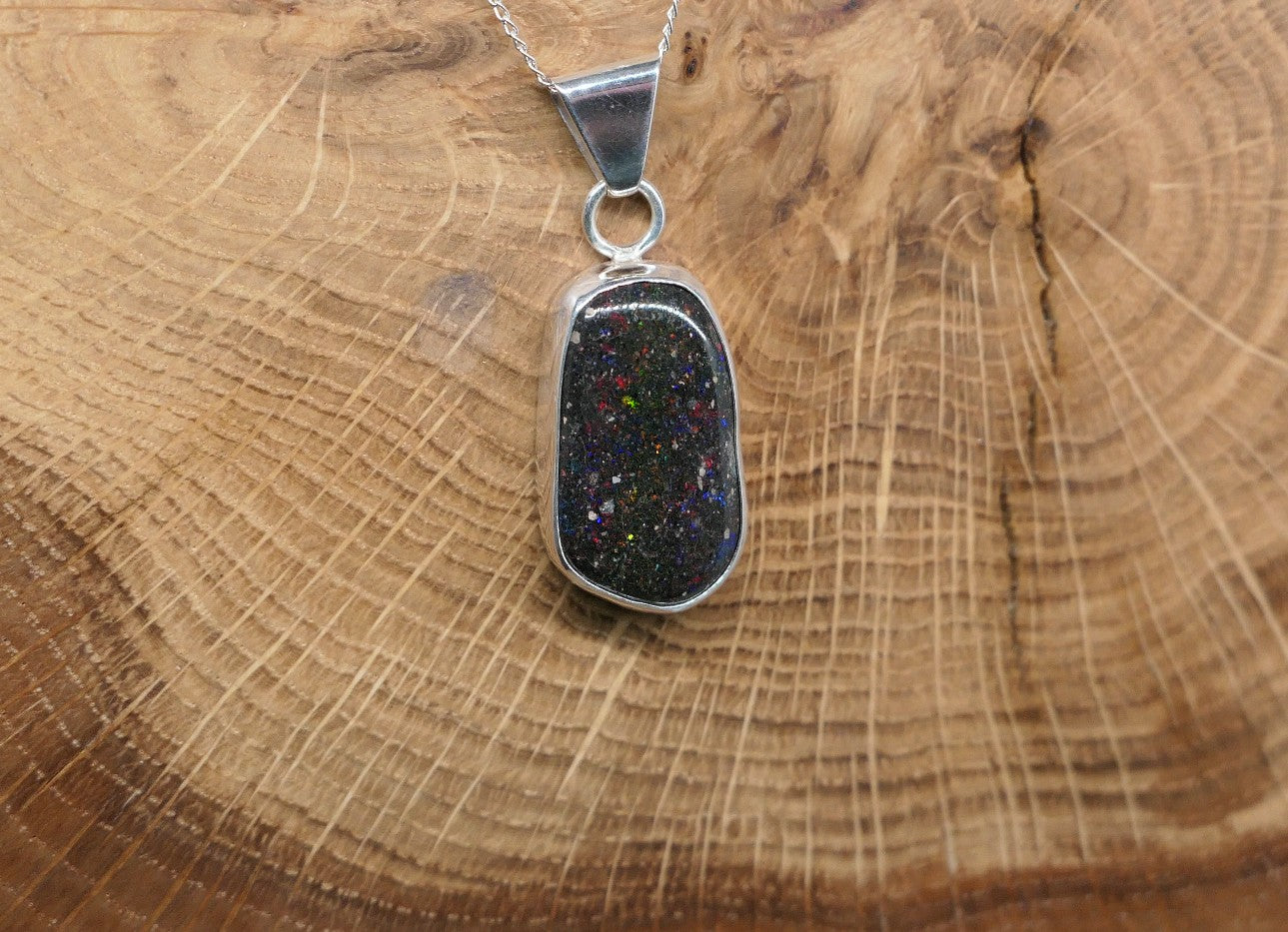 Silver opal pendant with a Honduran matrix opal