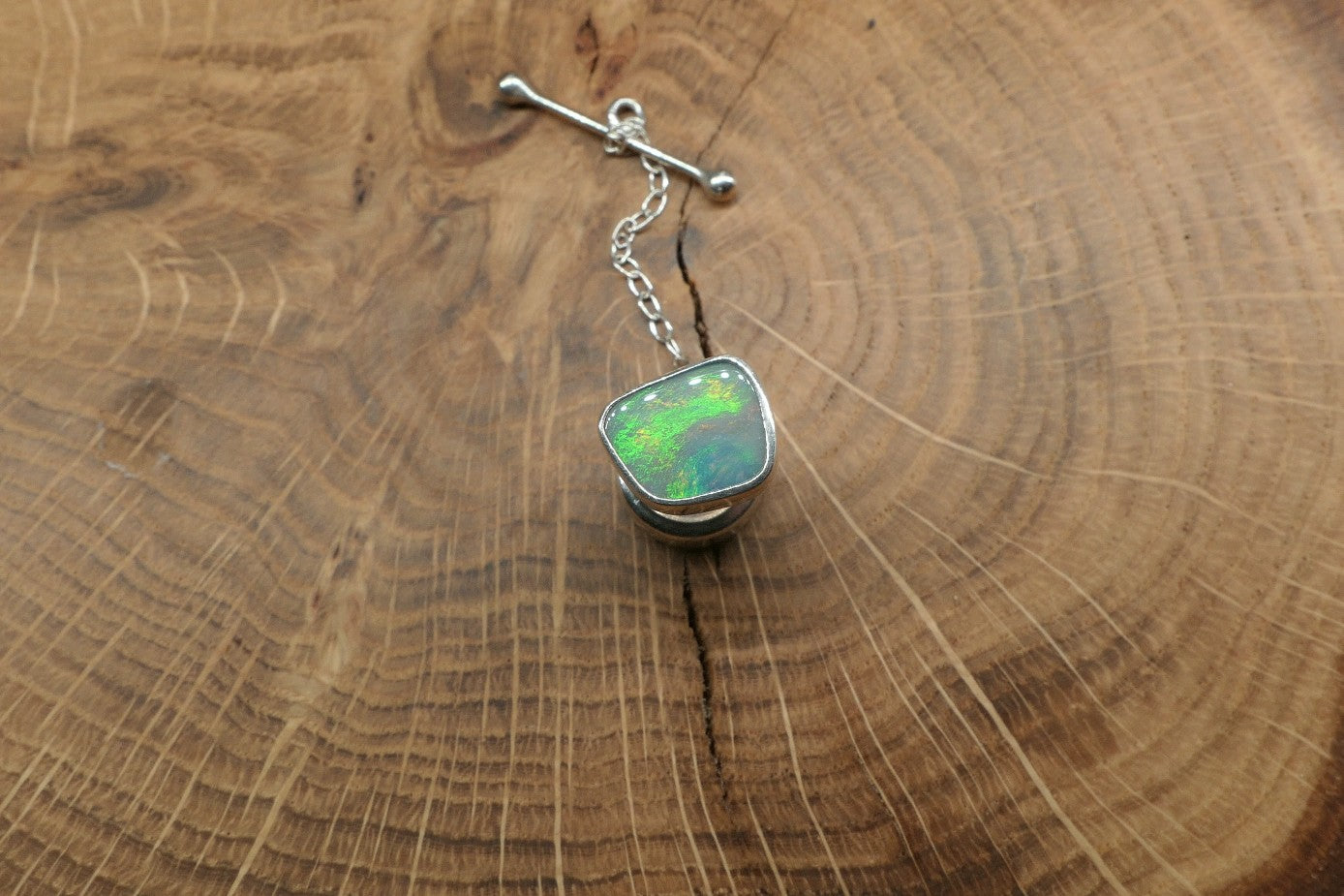 Silver tie tack with a Coober Pedy opal