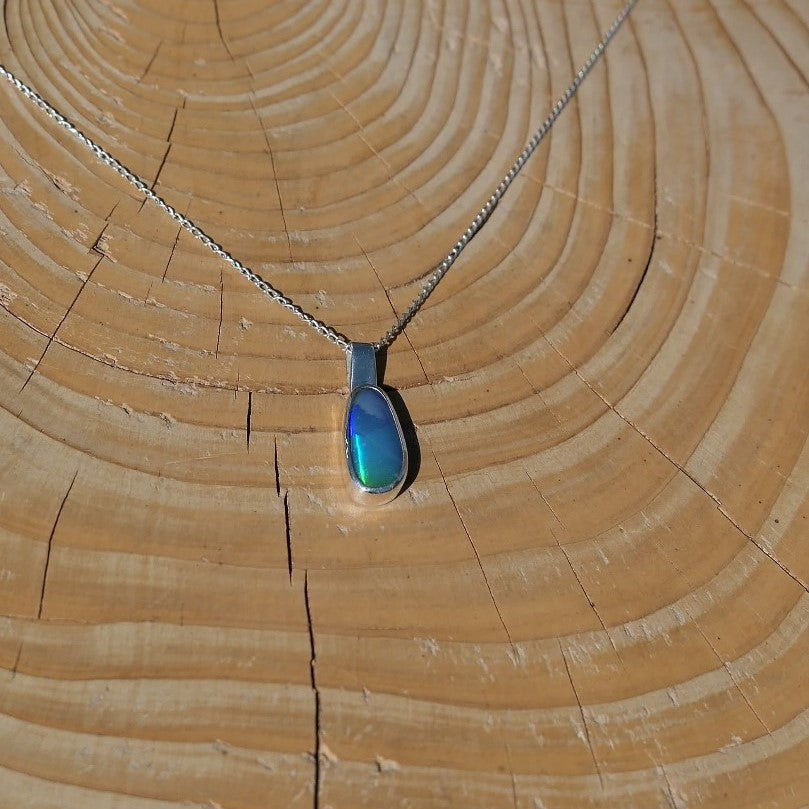 Silver pendant with a Coober Pedy doublet.