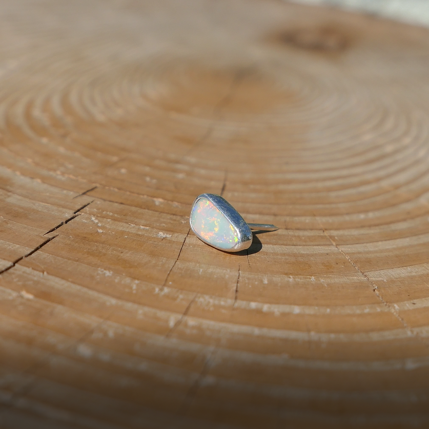 Silver tie tack with Coober Pedy solid opal.