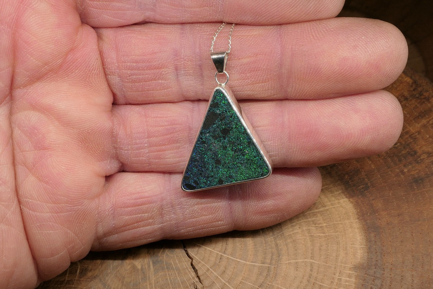 Silver opal pendant with an Andamooka matrix opal