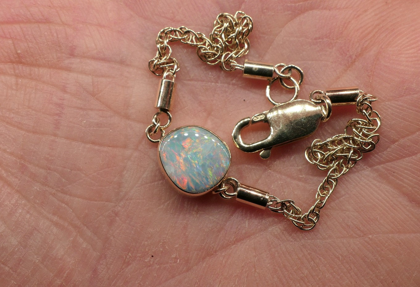 9k gold opal bracelet with a Mintubi solid opal.