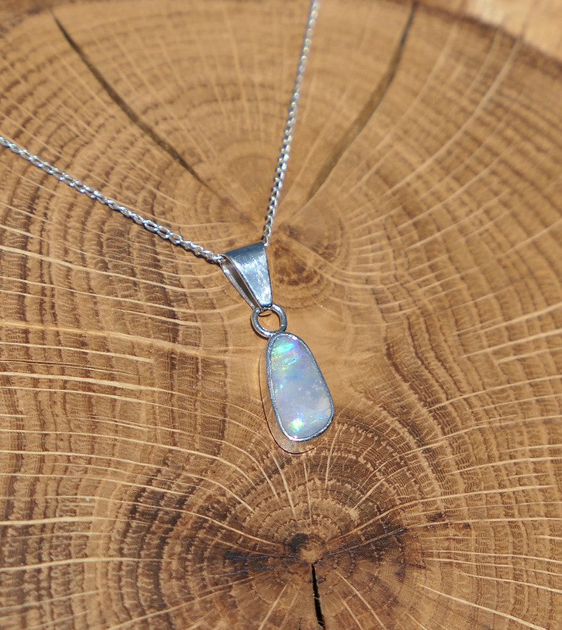Silver opal pendant with a Mintabie solid opal