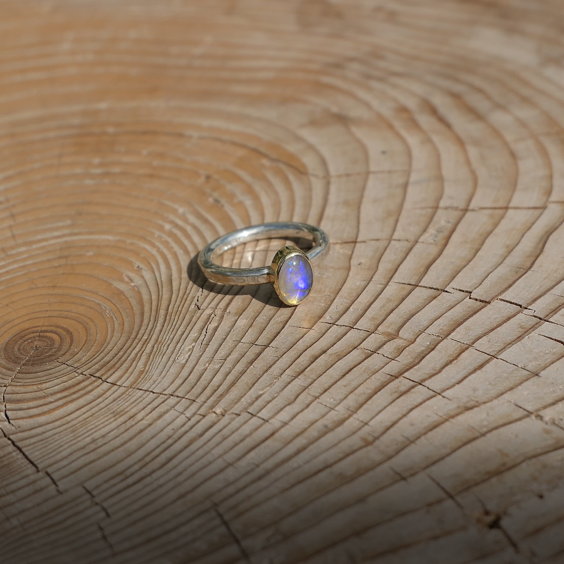 Silver opal ring with 18k gold bezel