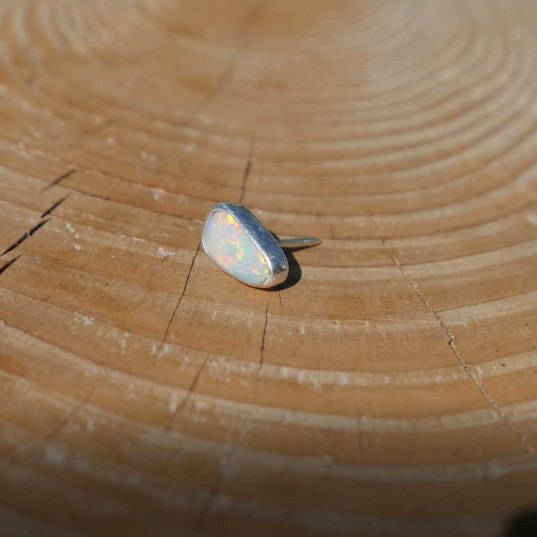 Silver tie tack with Coober Pedy solid opal.