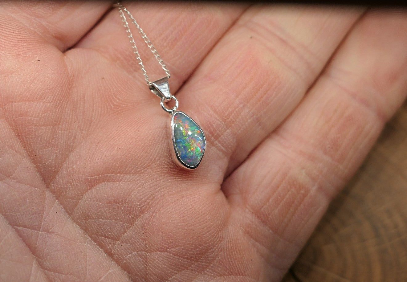 Opalised shell pendant