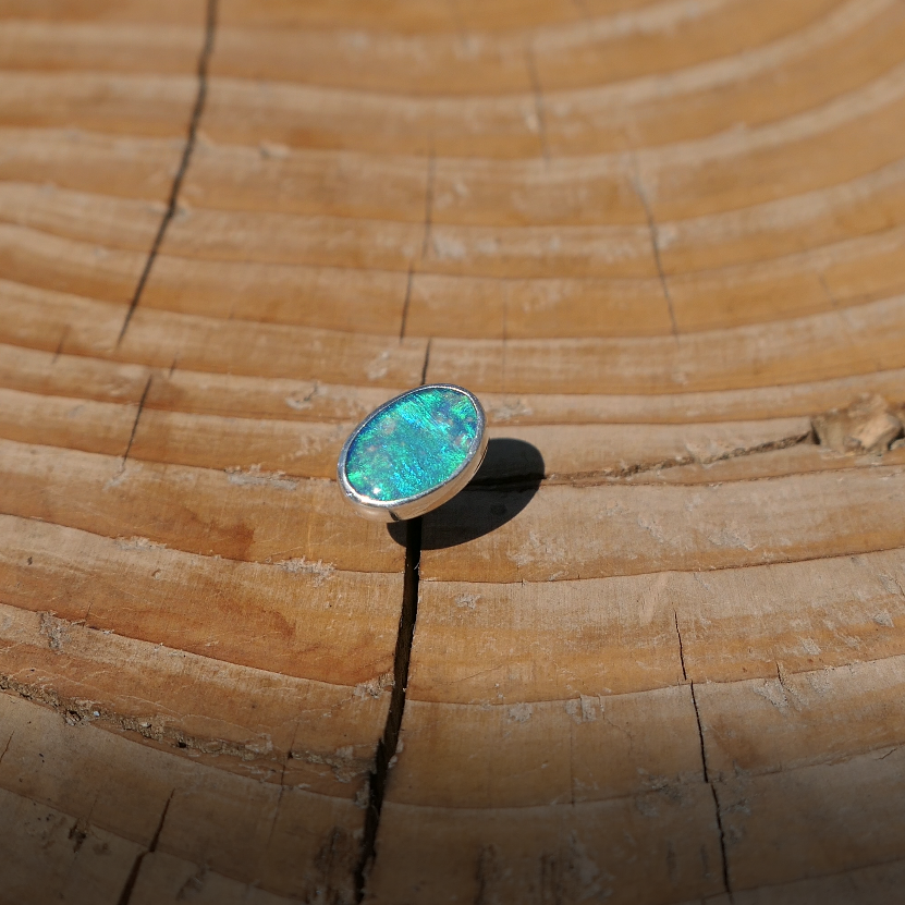 Silver tie tack with Coober Pedy opal.