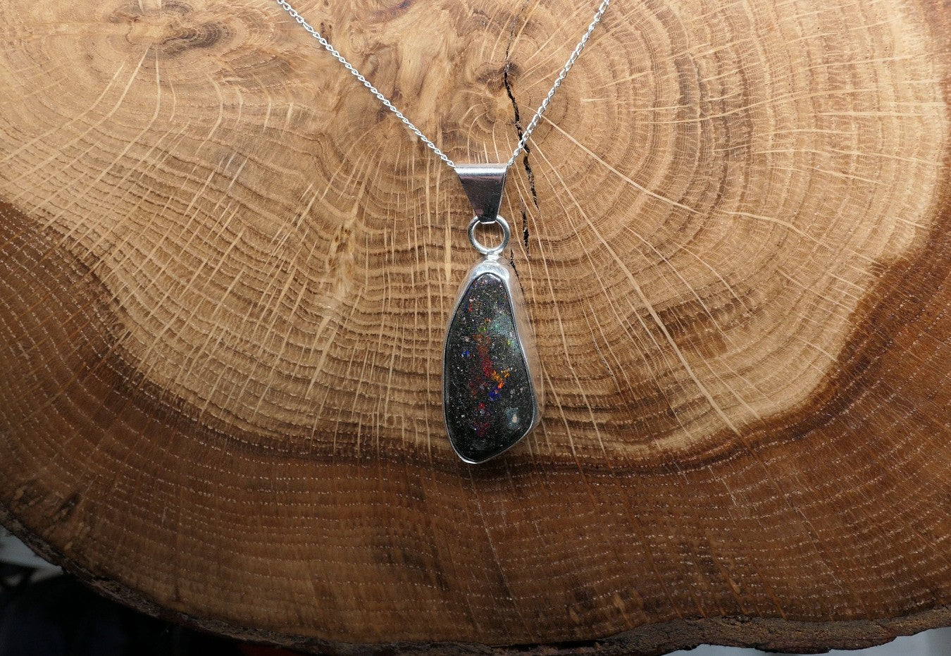 Silver opal pendant with a Honduran matrix opal