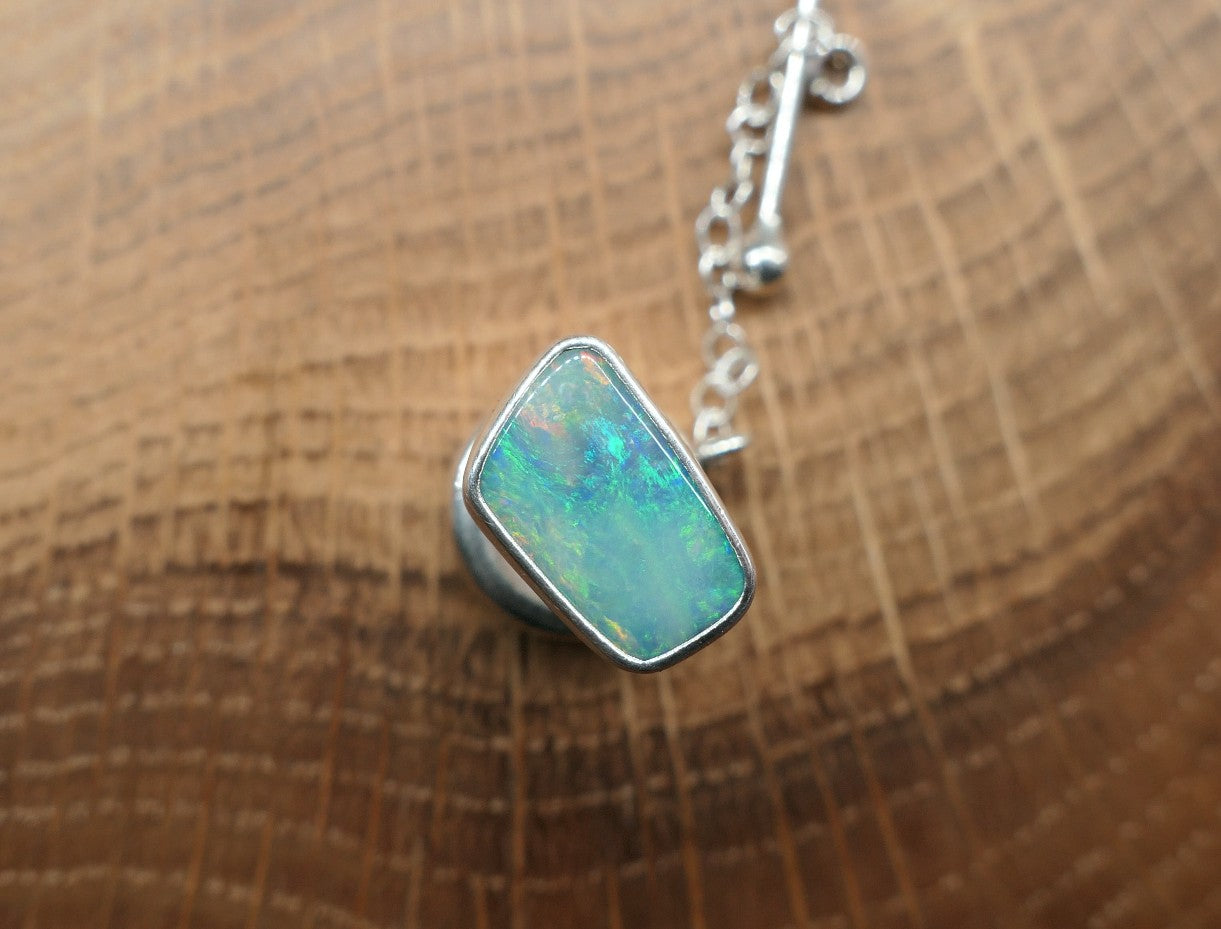 Silver tie tack with a Coober Pedy opal