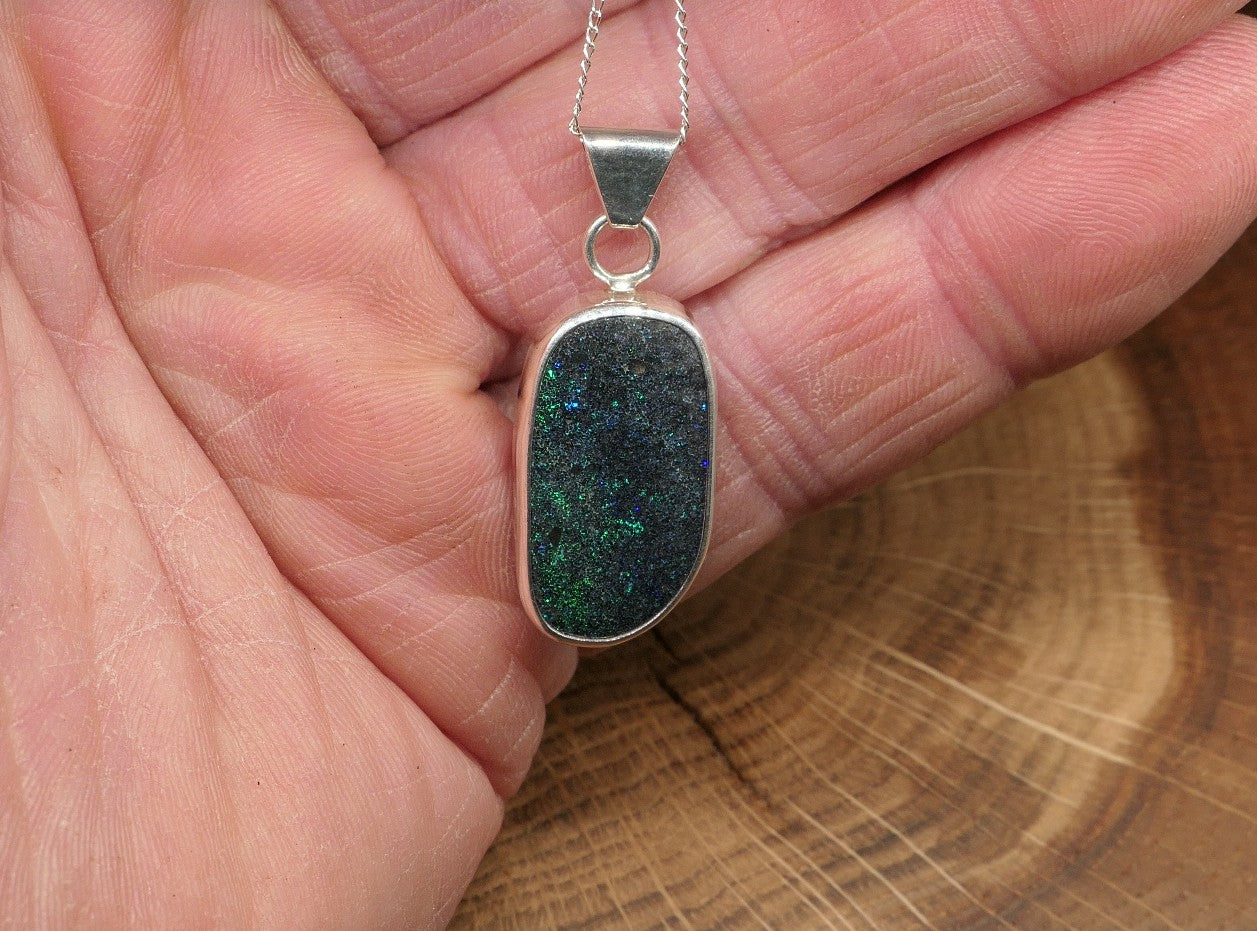 Silver opal pendant with an Andamooka marix opal