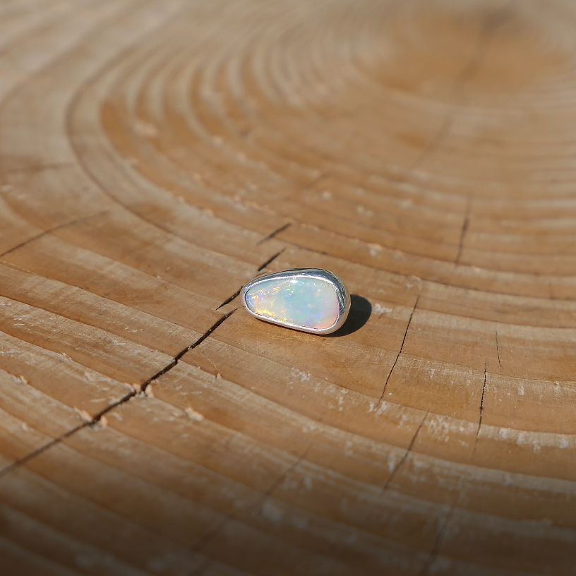 Silver tie tack with Coober Pedy solid opal.