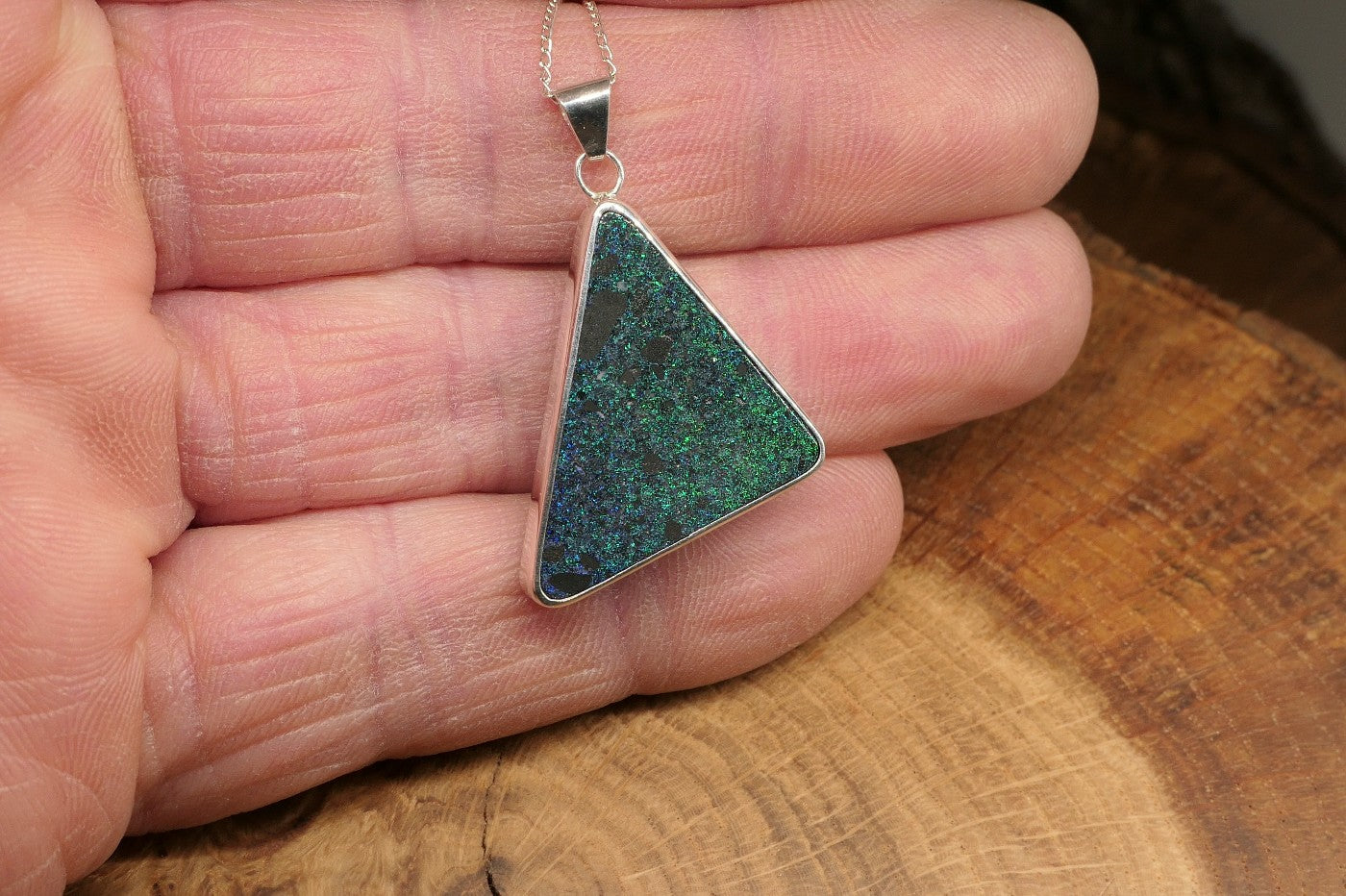 Silver opal pendant with an Andamooka matrix opal