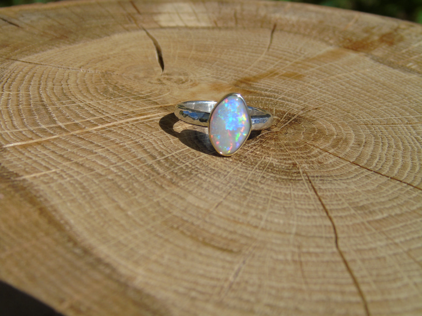 Lightning Ridge opal ring with 18k gold bezel