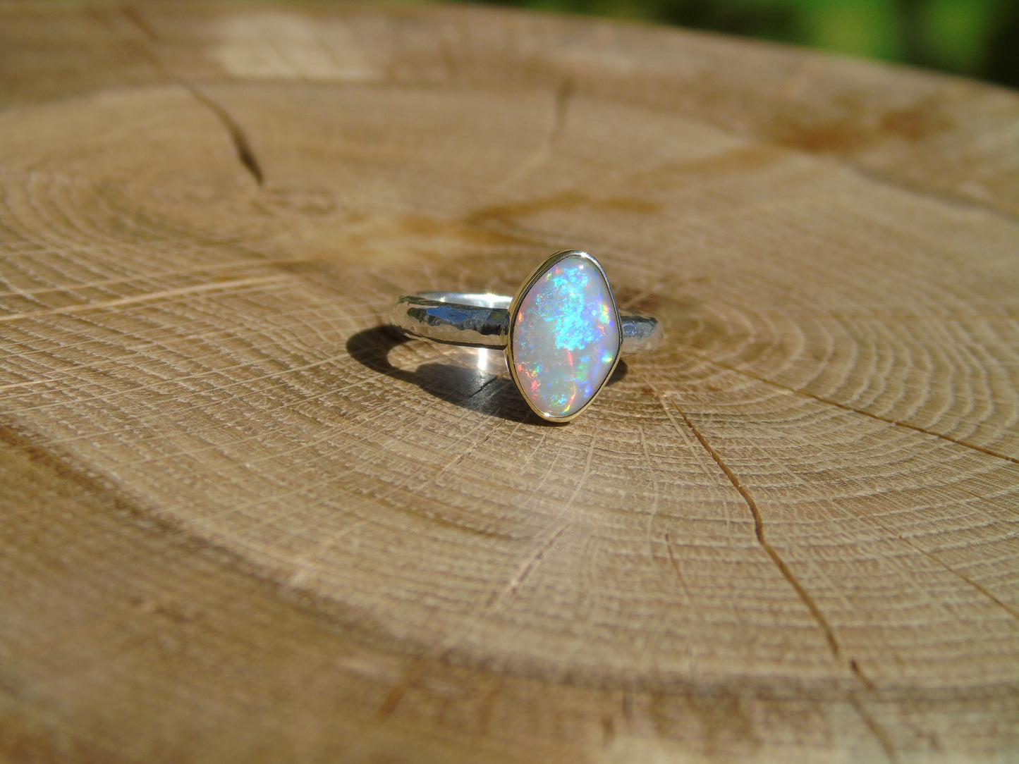 Lightning Ridge opal ring with 18k gold bezel