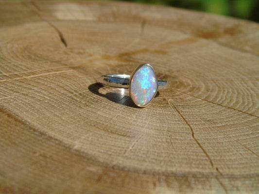 Lightning Ridge opal ring with 18k gold bezel