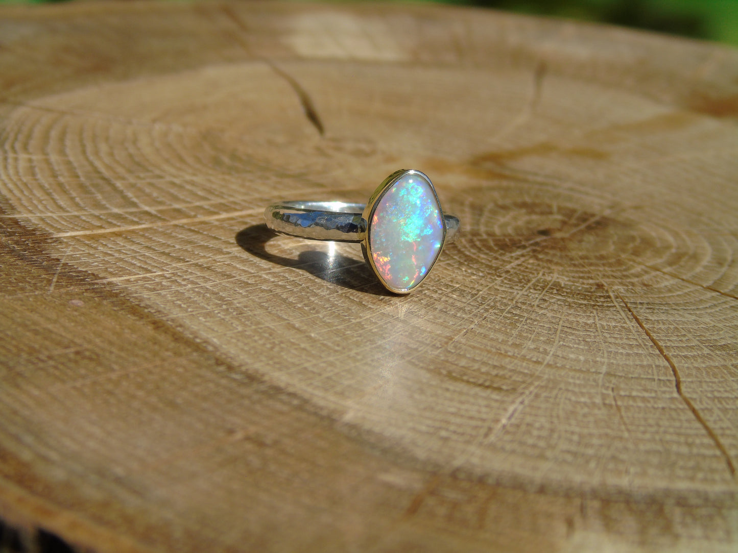 Lightning Ridge opal ring with 18k gold bezel