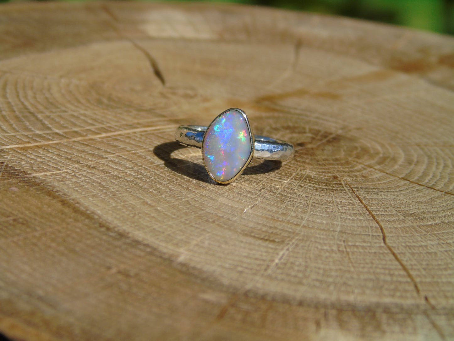 Lightning Ridge opal ring with 18k gold bezel