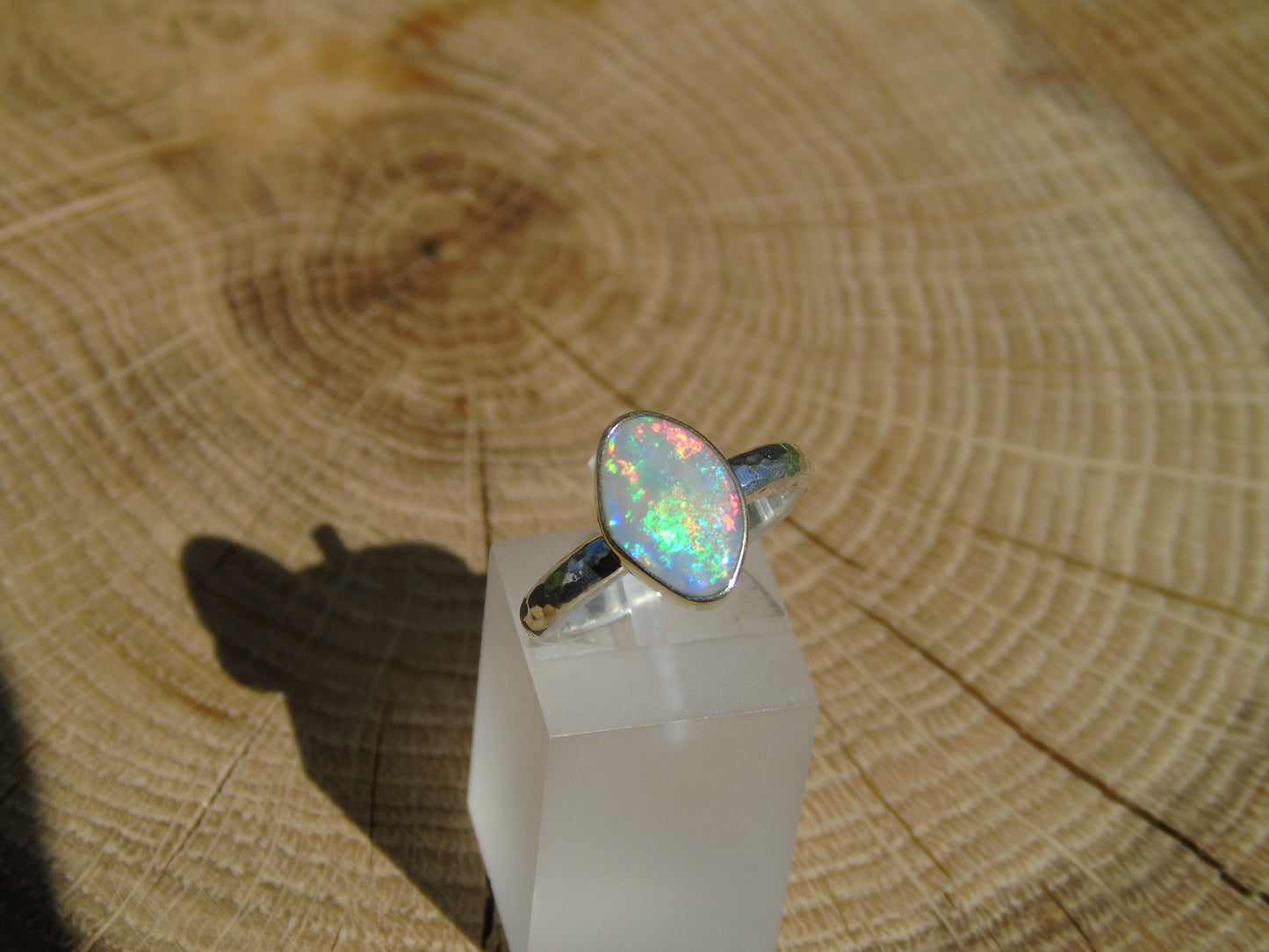 Lightning Ridge opal ring with 18k gold bezel