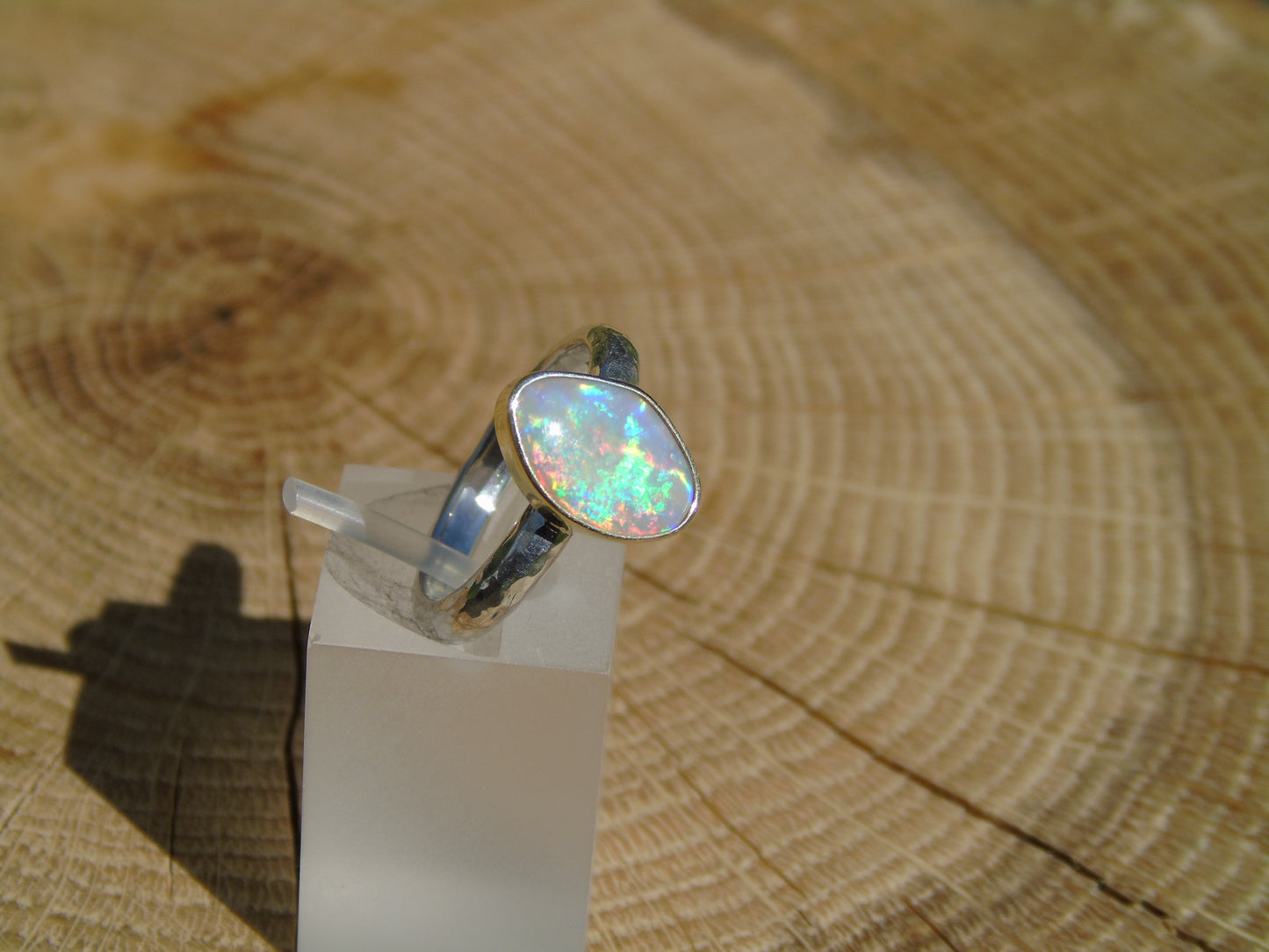 Lightning Ridge opal ring with 18k gold bezel