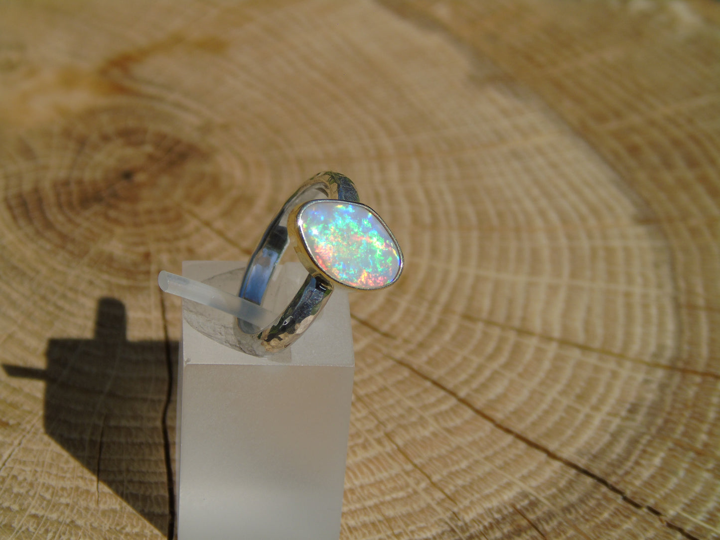 Lightning Ridge opal ring with 18k gold bezel