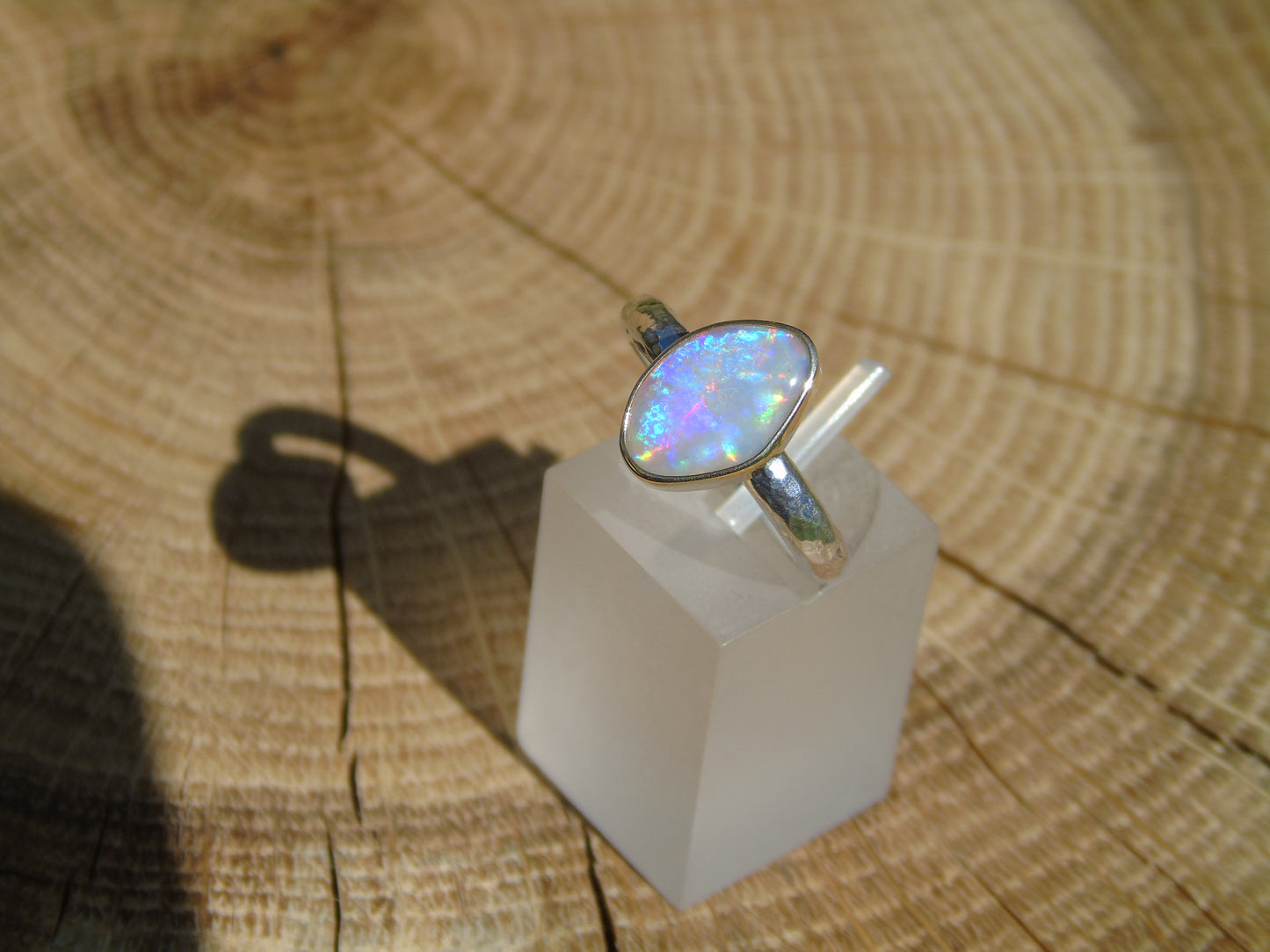 Lightning Ridge opal ring with 18k gold bezel