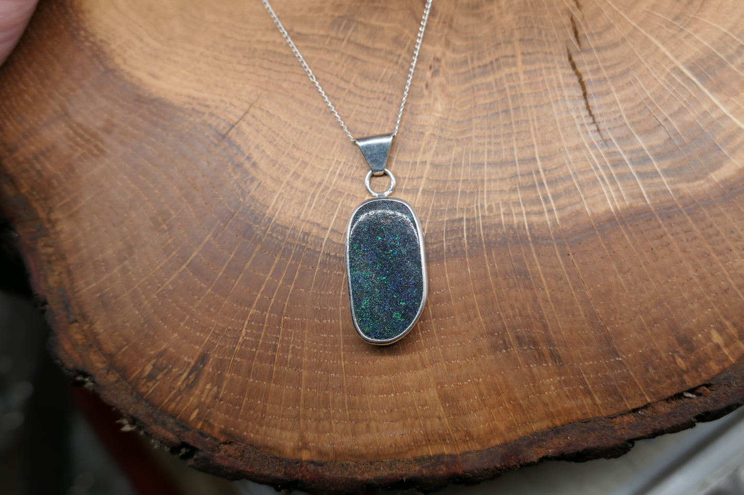 Silver opal pendant with an Andamooka marix opal