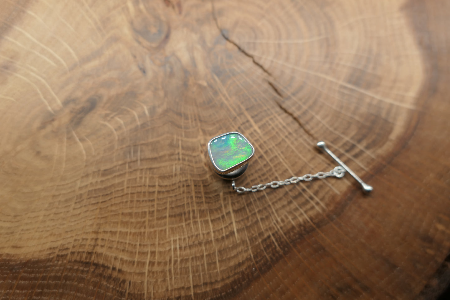 Silver tie tack with a Coober Pedy opal