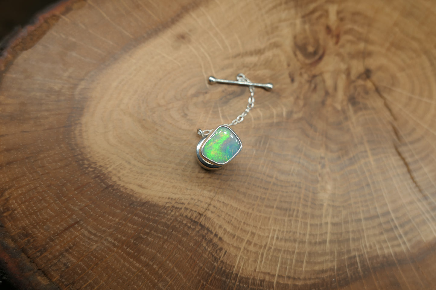 Silver tie tack with a Coober Pedy opal
