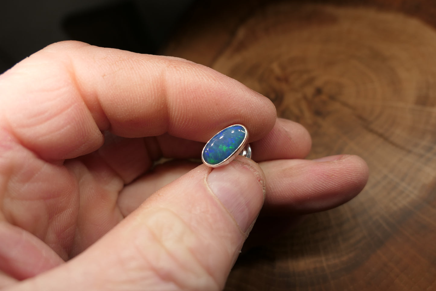 Silver tie tack with an Andamooka doublet opal