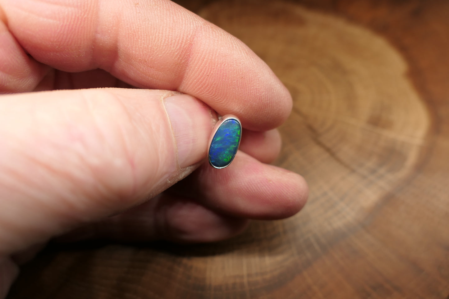 Silver tie tack with an Andamooka doublet opal