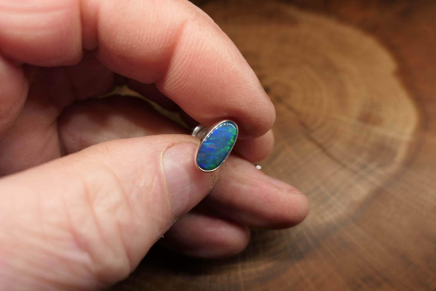Silver tie tack with an Andamooka doublet opal