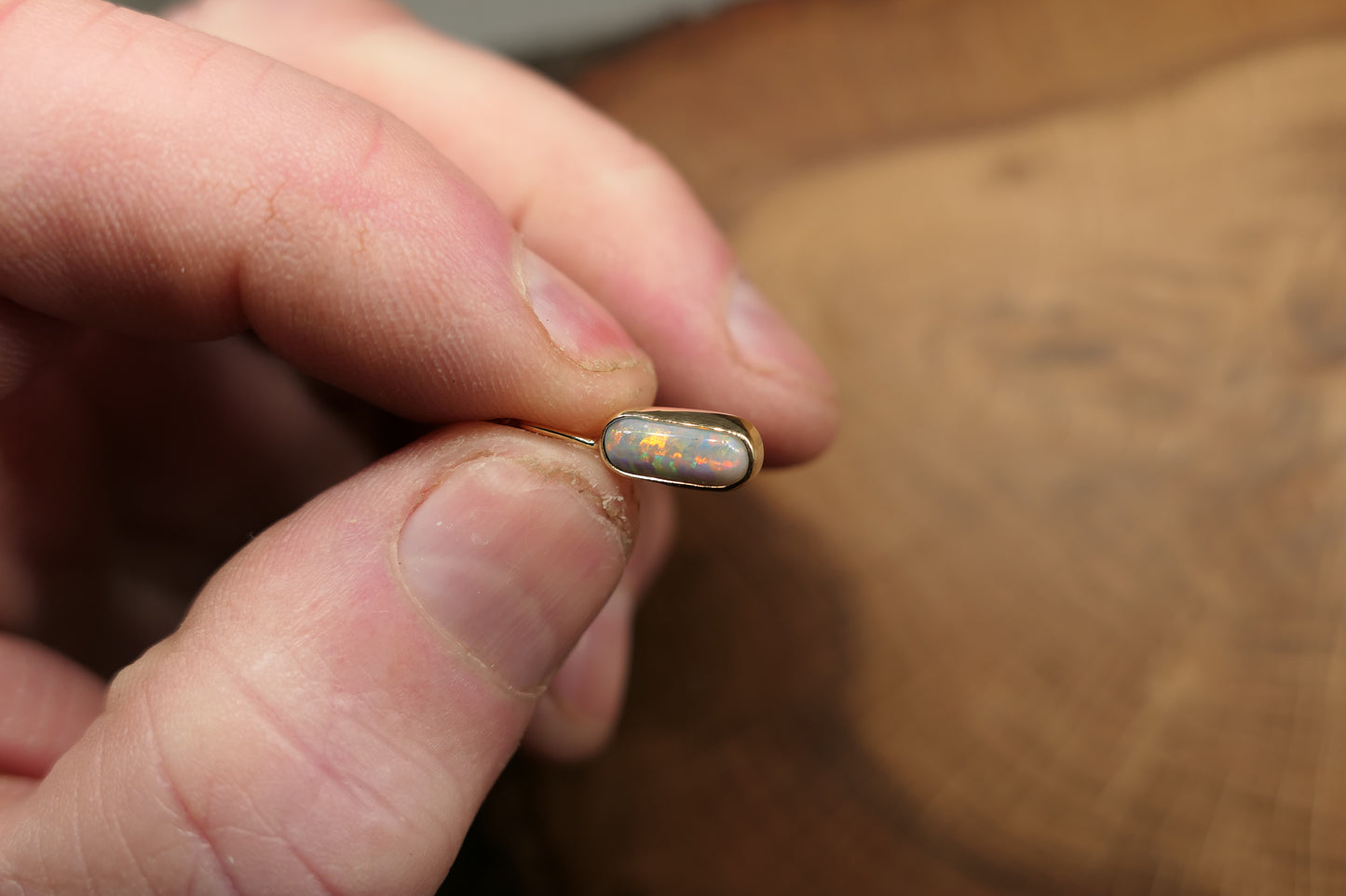 18k gold opal pendant with a Lightning Ridge black opal