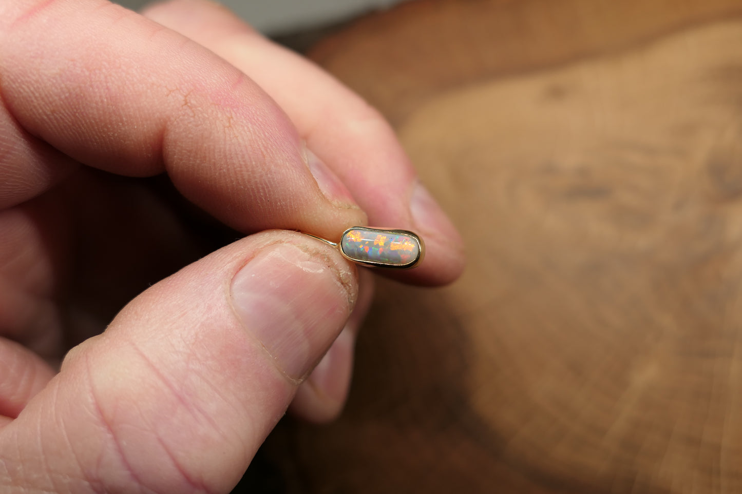 18k gold opal pendant with a Lightning Ridge black opal