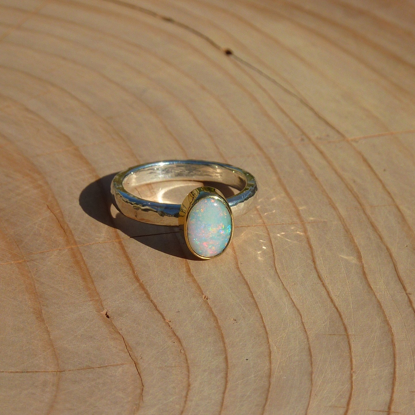 Dainty silver opal ring with 18k gold bezel