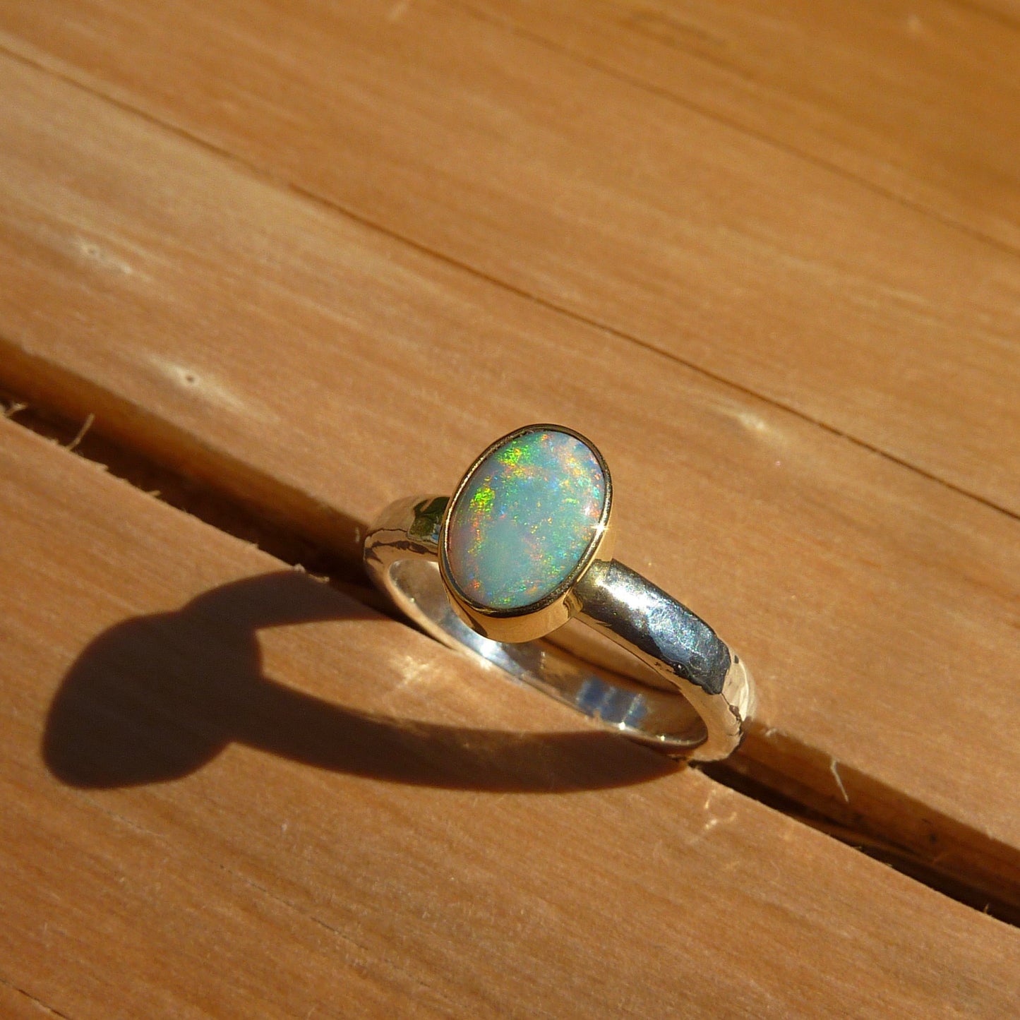 Dainty silver opal ring with 18k gold bezel