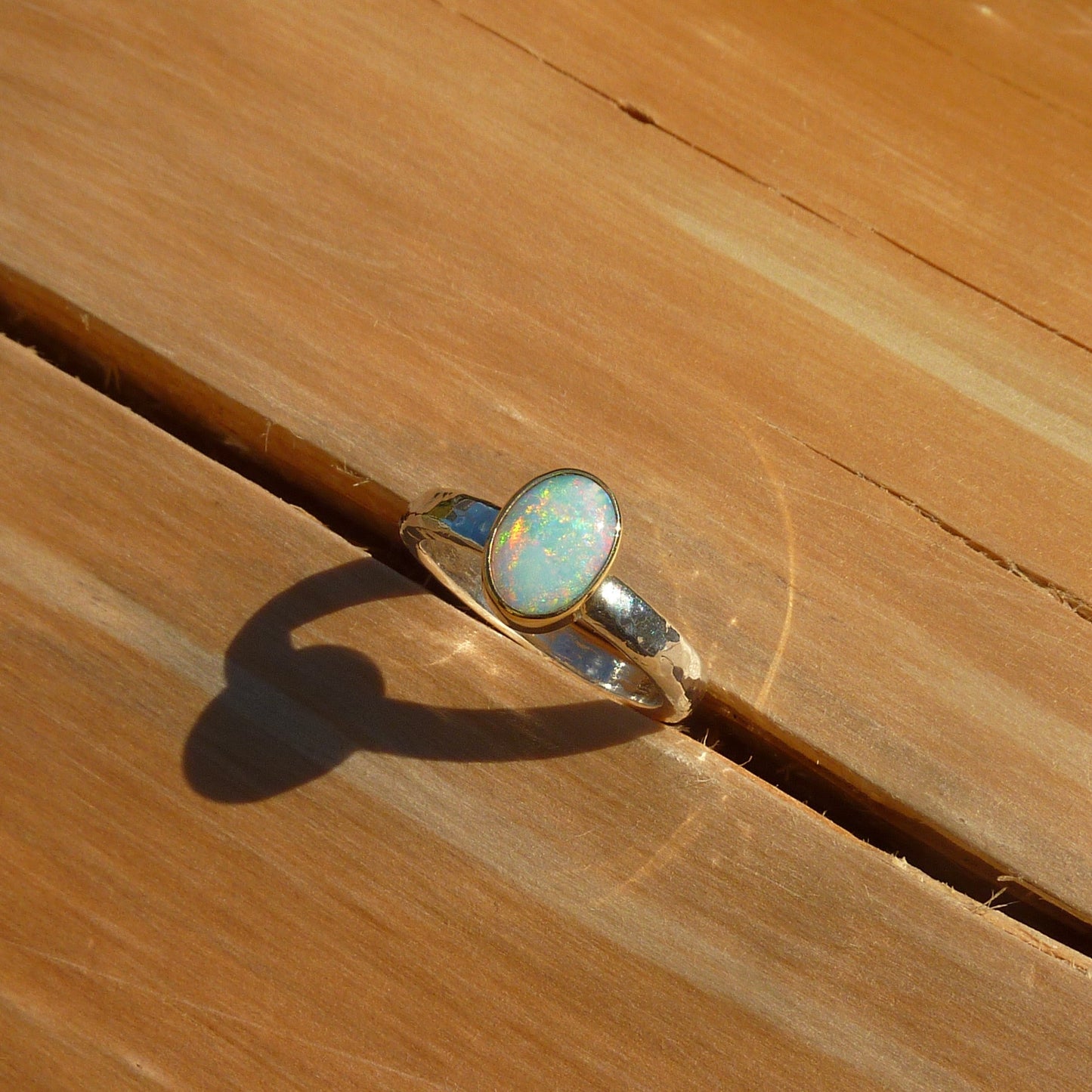 Dainty silver opal ring with 18k gold bezel