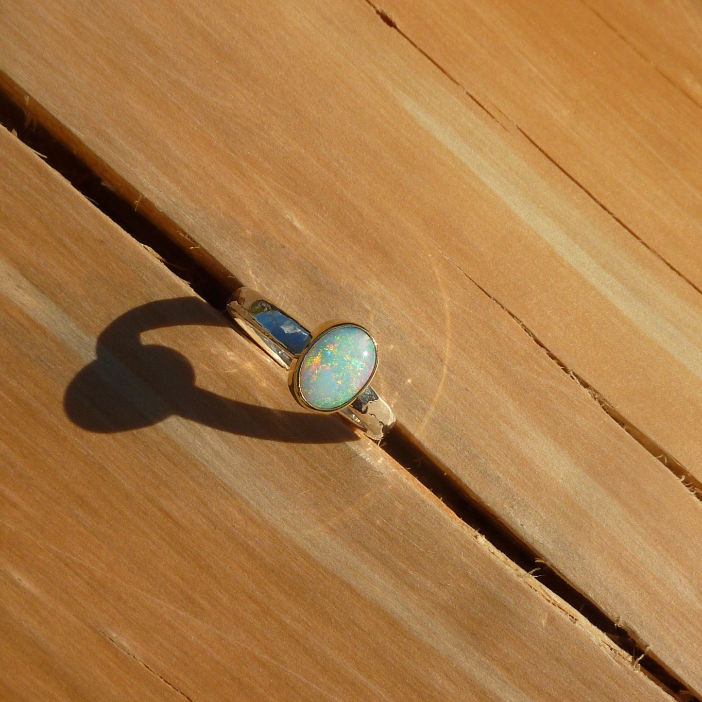 Dainty silver opal ring with 18k gold bezel