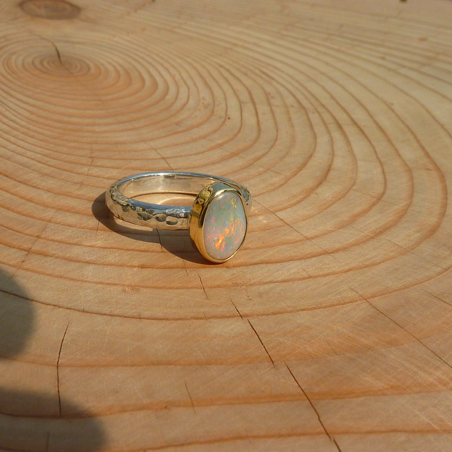 Silver opal ring with 18k gold bezel