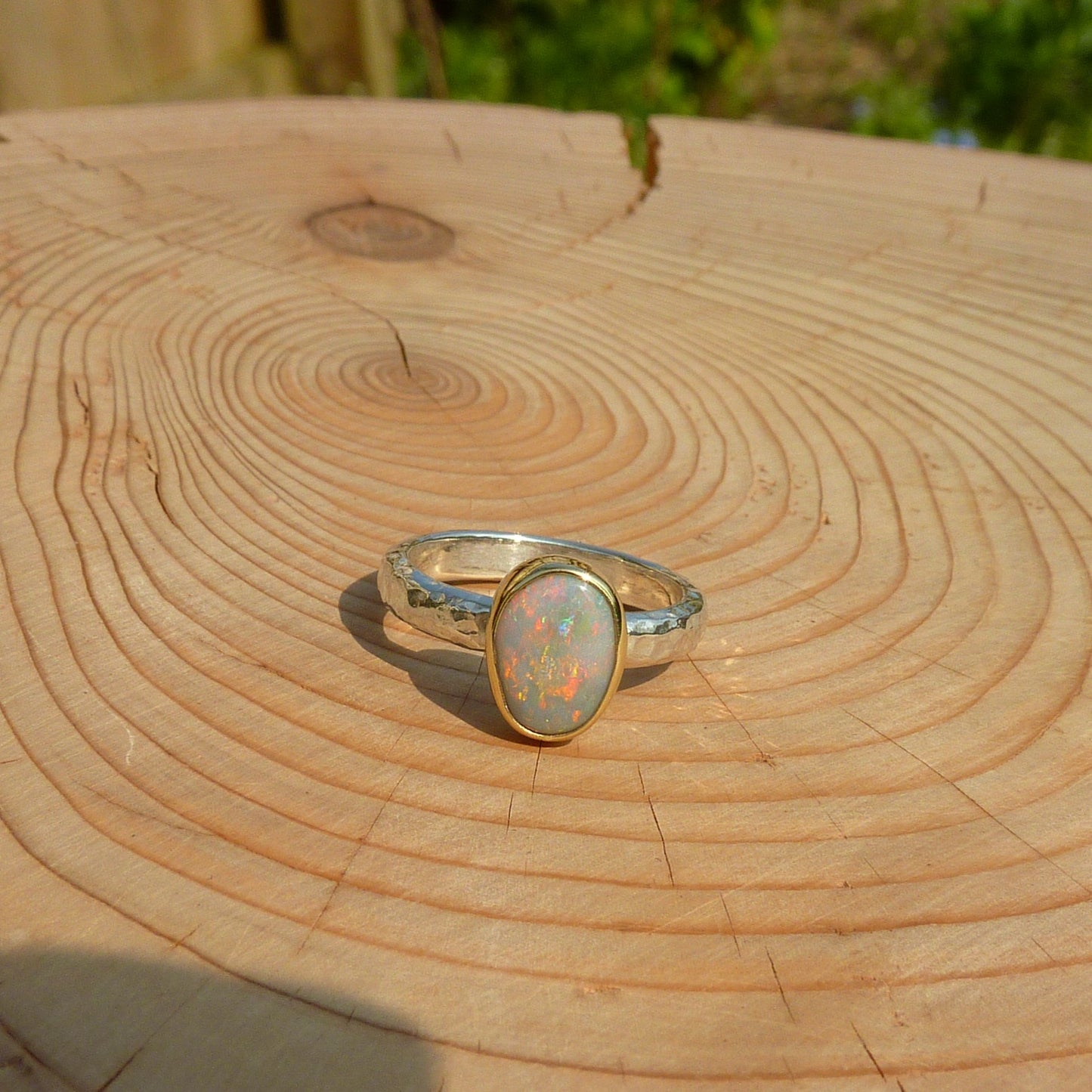 Silver opal ring with 18k gold bezel