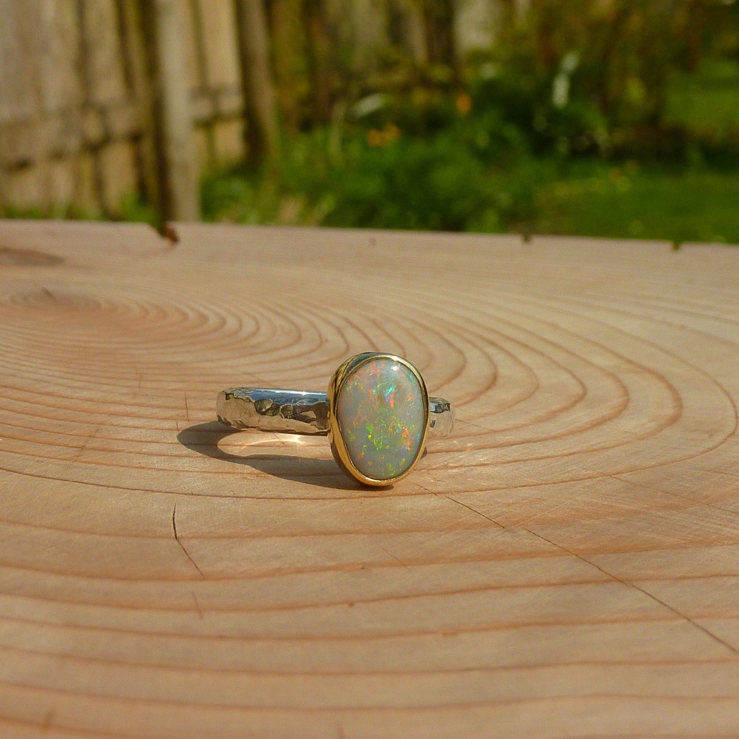 Silver opal ring with 18k gold bezel