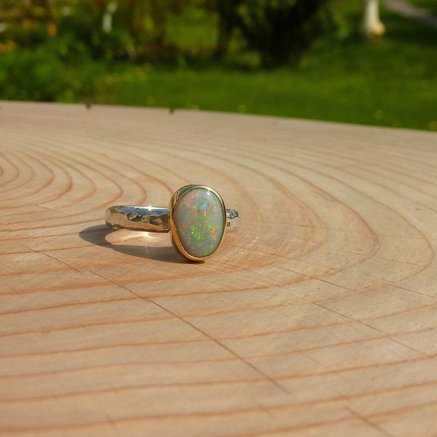 Silver opal ring with 18k gold bezel