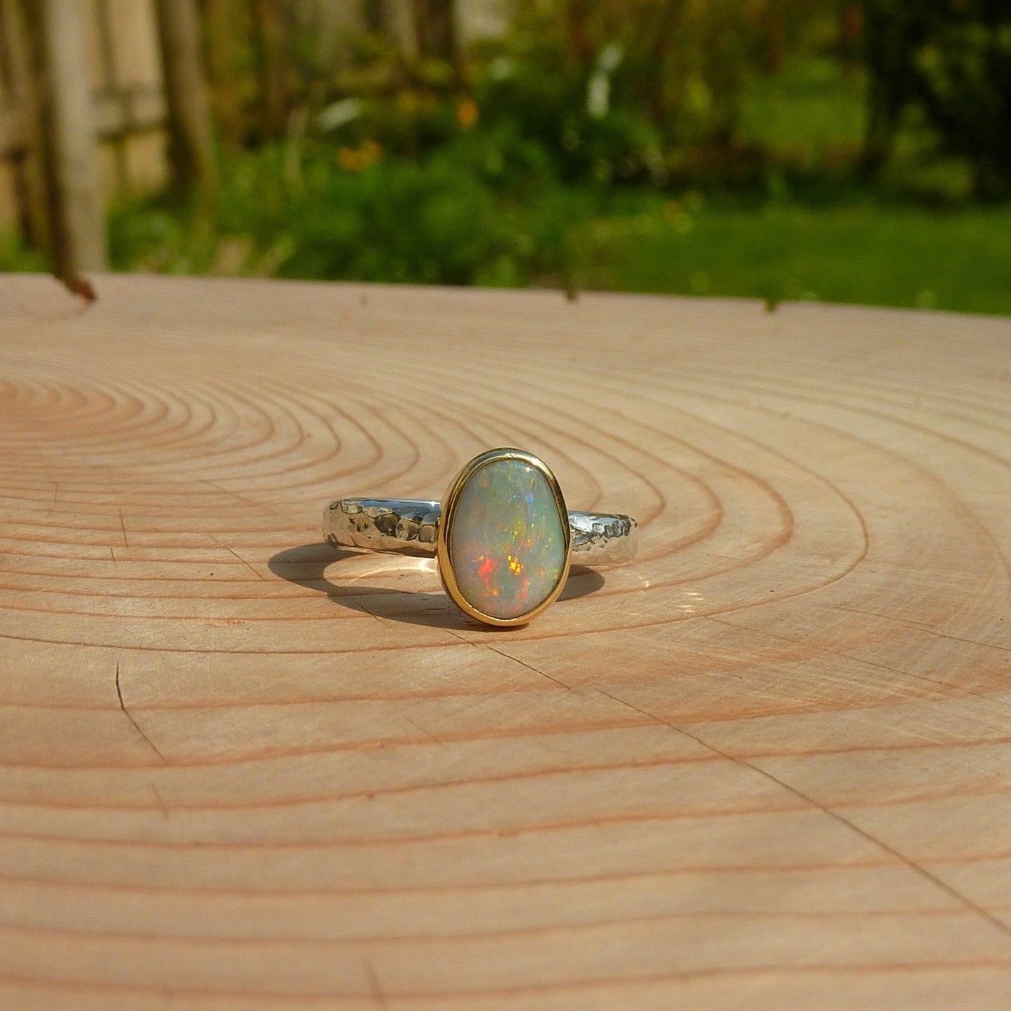 Silver opal ring with 18k gold bezel