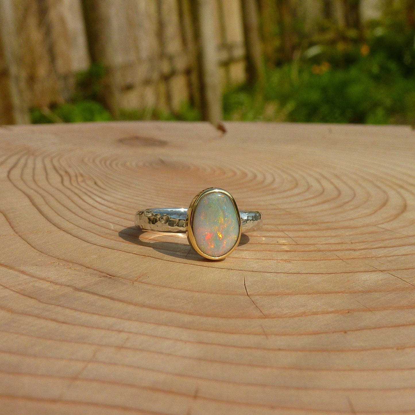 Silver opal ring with 18k gold bezel