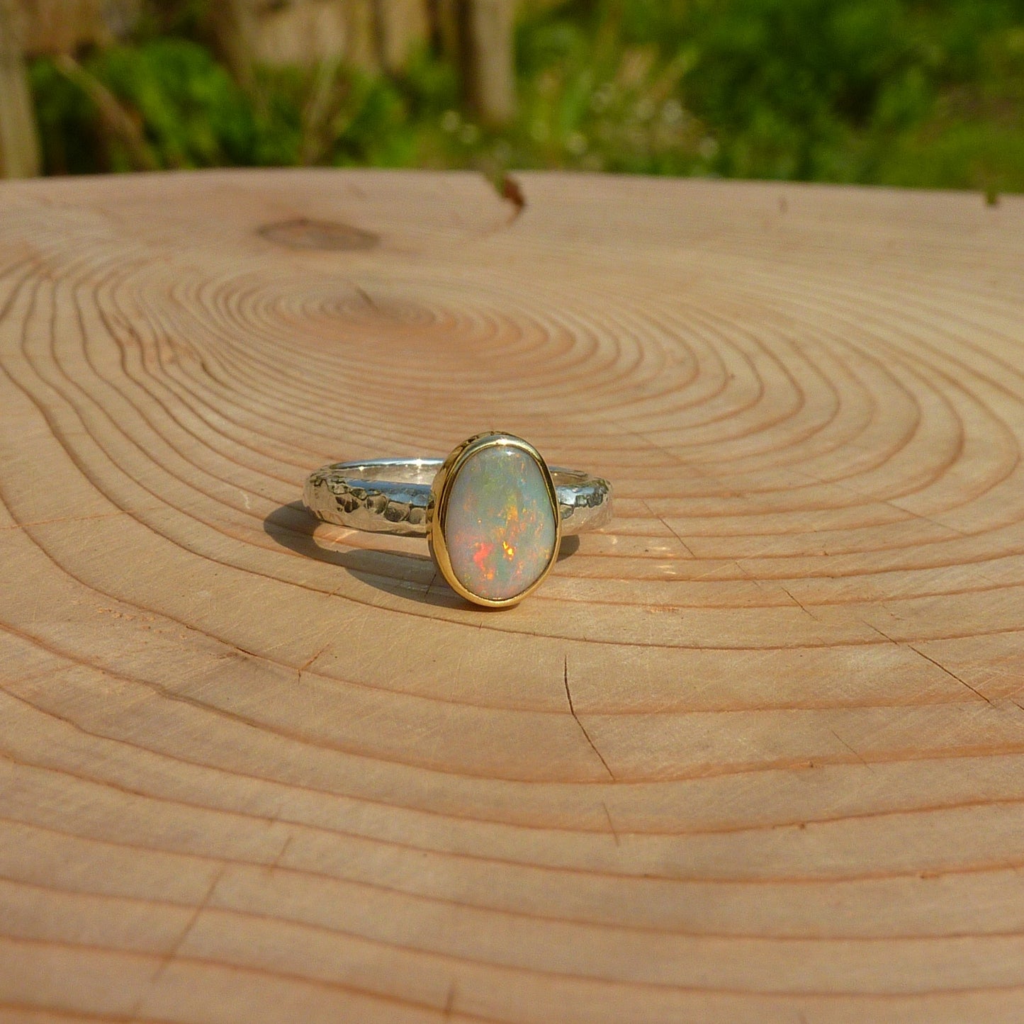 Silver opal ring with 18k gold bezel