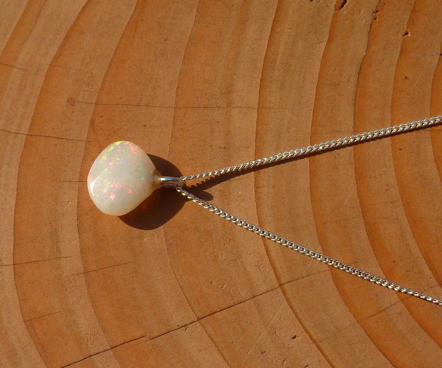 Opalised shell pendant