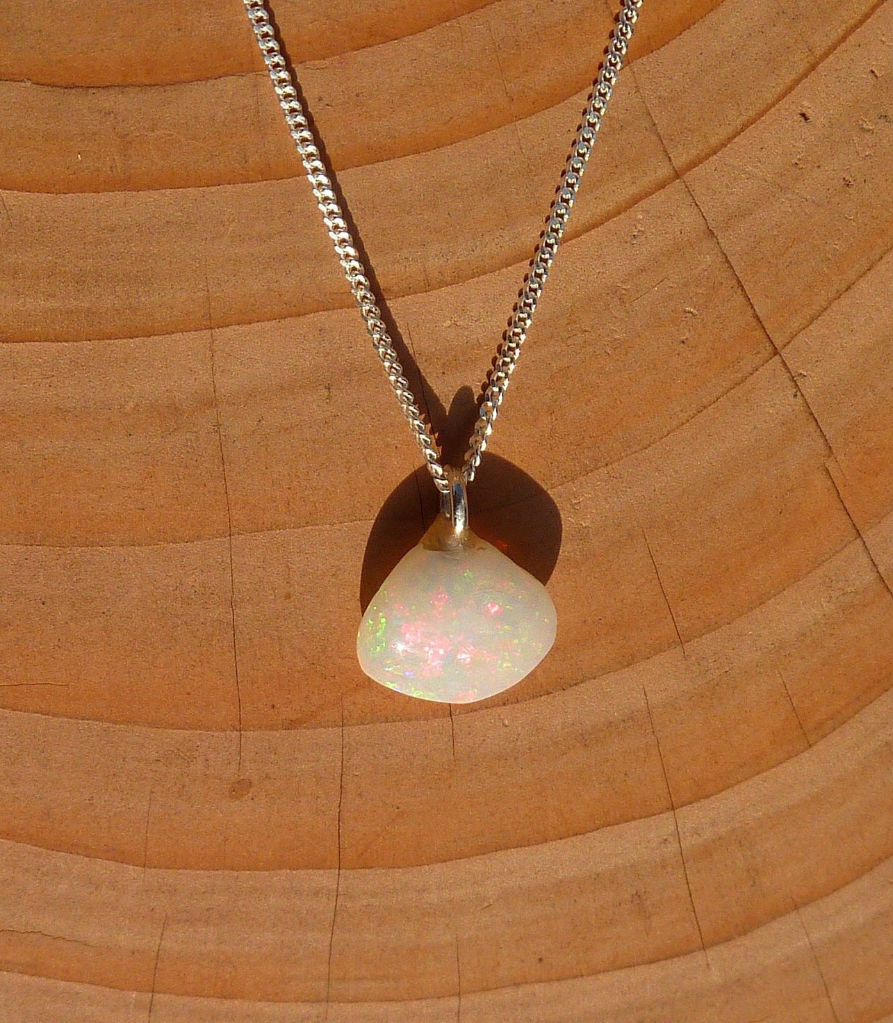 Opalised shell pendant