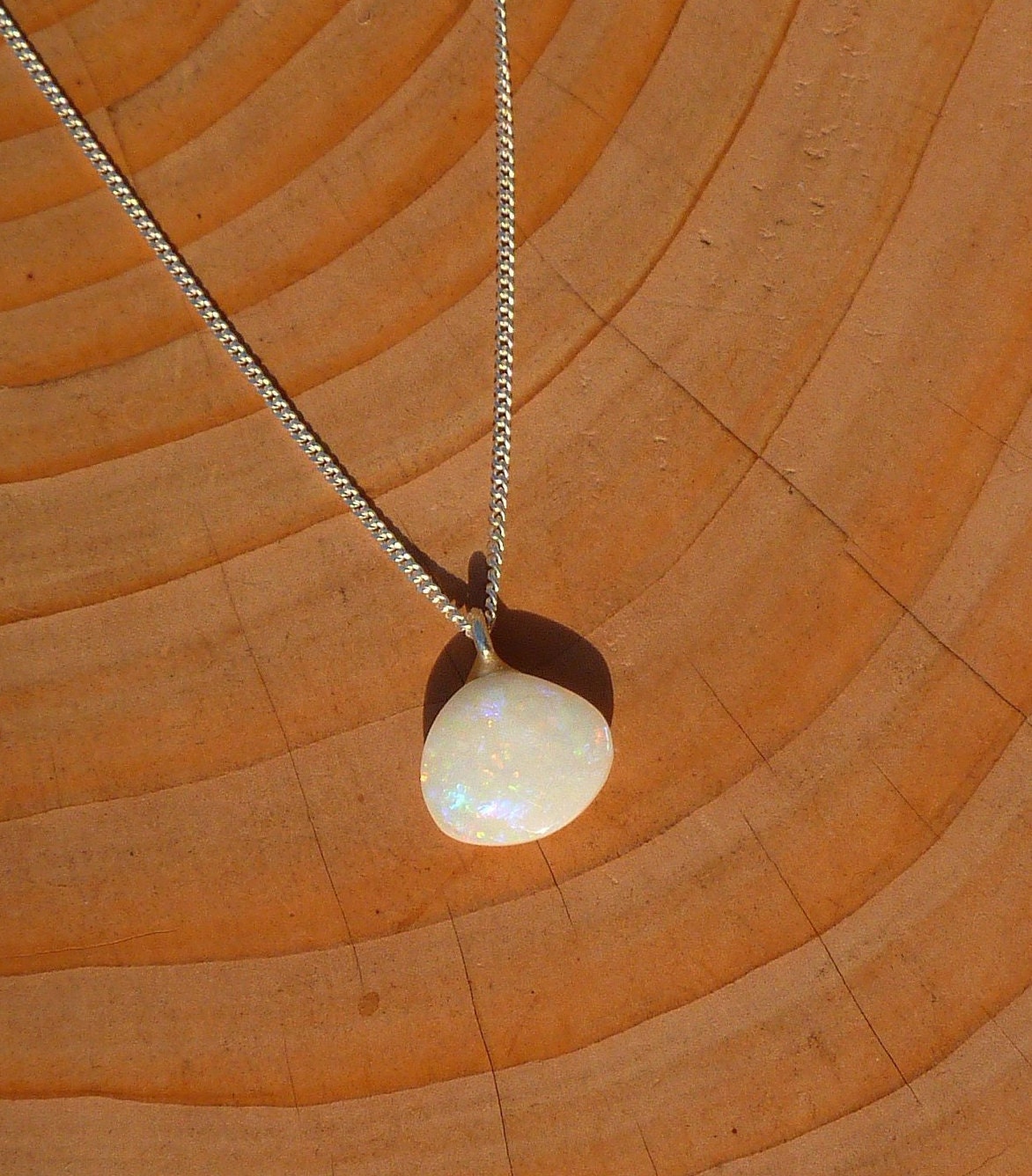 Opalised shell pendant